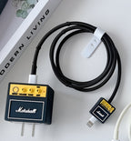 Marshall audio equipment with cables on a white surface